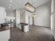 Open kitchen with stainless appliances and a breakfast bar that overlooks the living space at 4351 Highcroft Dr, Wesley Chapel, FL 33545