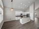 Bright kitchen featuring stainless steel appliances, plenty of counter space, and modern lighting at 4351 Highcroft Dr, Wesley Chapel, FL 33545