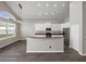 Spacious kitchen with stainless steel appliances, center island, and lots of natural light at 4351 Highcroft Dr, Wesley Chapel, FL 33545