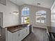 Open kitchen showcases granite countertops, stainless steel appliances, and elegant pendant lighting at 4351 Highcroft Dr, Wesley Chapel, FL 33545