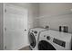 Laundry room with washer, dryer, and shelving at 4351 Highcroft Dr, Wesley Chapel, FL 33545