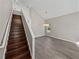 Bright living room features wood floors, neutral paint, and a modern light fixture at 4351 Highcroft Dr, Wesley Chapel, FL 33545