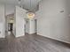 Expansive living area with high ceilings, modern lighting, and neutral paint at 4351 Highcroft Dr, Wesley Chapel, FL 33545