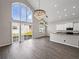 Bright living area features high ceilings, large windows, and stylish lighting fixtures at 4351 Highcroft Dr, Wesley Chapel, FL 33545