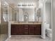 Main bathroom featuring a double vanity and glass shower at 4351 Highcroft Dr, Wesley Chapel, FL 33545