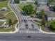 An aerial view of the neighborhood's entrance showcasing welcoming landscaping and a gated entry at 4351 Highcroft Dr, Wesley Chapel, FL 33545