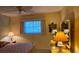 Cozy bedroom with a ceiling fan and a window providing natural light at 5975 Terrace Park N Dr # 102, St Petersburg, FL 33709