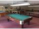 Brightly lit community game room with multiple pool tables for resident enjoyment at 5975 Terrace Park N Dr # 102, St Petersburg, FL 33709