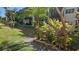 Lush landscaping surrounds the property, creating a serene and inviting atmosphere at 5975 Terrace Park N Dr # 102, St Petersburg, FL 33709