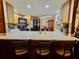 The kitchen features an eat-in bar and wood cabinets at 7711 Innis Ct, St Petersburg, FL 33709