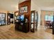 A warm and inviting living room connects to the dining area with wood-look floors at 7711 Innis Ct, St Petersburg, FL 33709