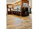 Bright living room features wooden accents and an eat-in kitchen bar at 7711 Innis Ct, St Petersburg, FL 33709