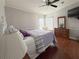 Comfortable bedroom featuring hardwood floors, natural light, and a dresser at 112 Saint Pierres Way, Apollo Beach, FL 33572
