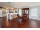 Dining area featuring hardwood floors, an elegant dining set, and kitchen access at 112 Saint Pierres Way, Apollo Beach, FL 33572