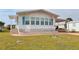 Charming single-story home with a well-maintained lawn and carport at 112 Saint Pierres Way, Apollo Beach, FL 33572