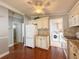 Well-equipped kitchen with full-sized appliances and adjacent laundry room at 112 Saint Pierres Way, Apollo Beach, FL 33572