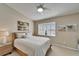 Bedroom with a white bed, a ceiling fan, and a window with plantation shutters at 17960 Gulf Blvd # 103, Redington Shores, FL 33708