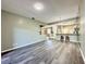 Open living area with modern gray flooring and seamless transition to the kitchen at 2116 Nantucket Dr # 19, Sun City Center, FL 33573