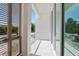Modern balcony with sleek, minimalist railings, an architectural screen, and a bright, sunny view at 2702 N Woodrow Ave # 2, Tampa, FL 33602