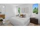 Inviting bedroom with a comfortable bed, neutral decor, and windows offering natural light at 2702 N Woodrow Ave # 2, Tampa, FL 33602