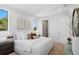 Serene bedroom featuring neutral tones, ambient lighting, and a view of outdoor greenery at 2702 N Woodrow Ave # 2, Tampa, FL 33602