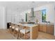 Modern kitchen featuring a large island, stainless steel appliances, and white cabinetry at 2702 N Woodrow Ave # 2, Tampa, FL 33602