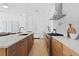 Spacious kitchen featuring wood cabinets, stainless steel appliances, and a white marble backsplash at 2702 N Woodrow Ave # 2, Tampa, FL 33602