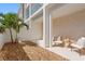 Private patio with gravel landscaping, modern furnishings, and neutral tones at 2702 N Woodrow Ave # 2, Tampa, FL 33602