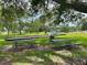 A park with tables, benches, a swing set and playground for resident's enjoyment at 2722 Scobee Dr, Palm Harbor, FL 34683