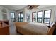 Bright bedroom featuring a ceiling fan, ample natural light and tiled floors at 2757 Via Cipriani # 1114A, Clearwater, FL 33764