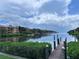 Scenic view of the bay from the end of a private community dock under a partly cloudy sky at 2757 Via Cipriani # 1114A, Clearwater, FL 33764