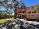 Inviting multi-story townhome with a well-manicured lawn and attached two car garage at 2757 Via Cipriani # 1114A, Clearwater, FL 33764