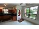 Cozy kitchen featuring granite countertops, wood cabinets, and a water view at 2757 Via Cipriani # 1114A, Clearwater, FL 33764