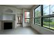 Inviting living room with tile floors, fireplace and large windows offering views at 2757 Via Cipriani # 1114A, Clearwater, FL 33764