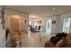 Open concept living room featuring neutral walls, tile floors and archways leading to other rooms at 2757 Via Cipriani # 1114A, Clearwater, FL 33764