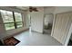 Cozy living space featuring a ceiling fan, tile floors, natural light, and a closet at 2757 Via Cipriani # 1114A, Clearwater, FL 33764