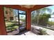 Relaxing screened-in porch with a tranquil view of lush greenery and the water at 2757 Via Cipriani # 1114A, Clearwater, FL 33764
