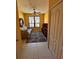 Comfortable sitting area with a patterned rug, decorative mirror and natural light at 2757 Via Cipriani # 1114A, Clearwater, FL 33764