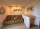 Cozy upstairs sitting area with modern artwork and comfortable seating at 2757 Via Cipriani # 1114A, Clearwater, FL 33764