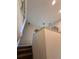 Bright staircase leading to the upper level of the home at 2757 Via Cipriani # 1114A, Clearwater, FL 33764