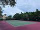 Outdoor tennis court perfect for recreational play and fitness, complete with netting and fencing at 2757 Via Cipriani # 1114A, Clearwater, FL 33764