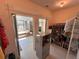 Bright walk-in closet with custom shelving, rod hanging, and storage space connected to bathroom at 2757 Via Cipriani # 1114A, Clearwater, FL 33764