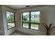 Bright room with tile floors, white walls, shuttered windows offering serene lake views at 2757 Via Cipriani # 1114A, Clearwater, FL 33764