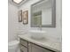 Bathroom with a modern vanity, granite countertop, vessel sink and framed mirror at 3985 Mermoor Dr, Palm Harbor, FL 34685