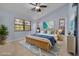 Bright bedroom featuring a wicker bed, coastal-inspired decor, and an abundance of natural light at 3985 Mermoor Dr, Palm Harbor, FL 34685