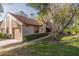 Exterior shot of the townhome with a well-maintained lawn and driveway at 3985 Mermoor Dr, Palm Harbor, FL 34685
