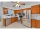 Well-appointed kitchen featuring stainless steel appliances and tile countertops at 3985 Mermoor Dr, Palm Harbor, FL 34685