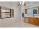 Bright kitchen showcasing stainless steel dishwasher, ample counter space, and modern backsplash at 3985 Mermoor Dr, Palm Harbor, FL 34685