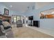 Inviting living room with a stone fireplace and views of the kitchen at 3985 Mermoor Dr, Palm Harbor, FL 34685