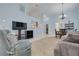 Bright and airy living room with an open layout to the kitchen and dining area at 3985 Mermoor Dr, Palm Harbor, FL 34685